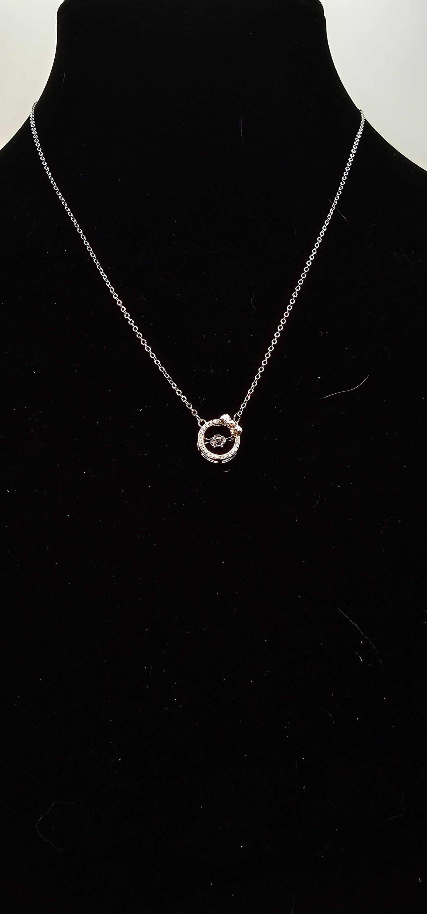 SILVER CIRCLE WITH BOW NECKLACE