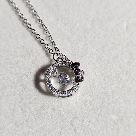 SILVER CIRCLE WITH BOW NECKLACE