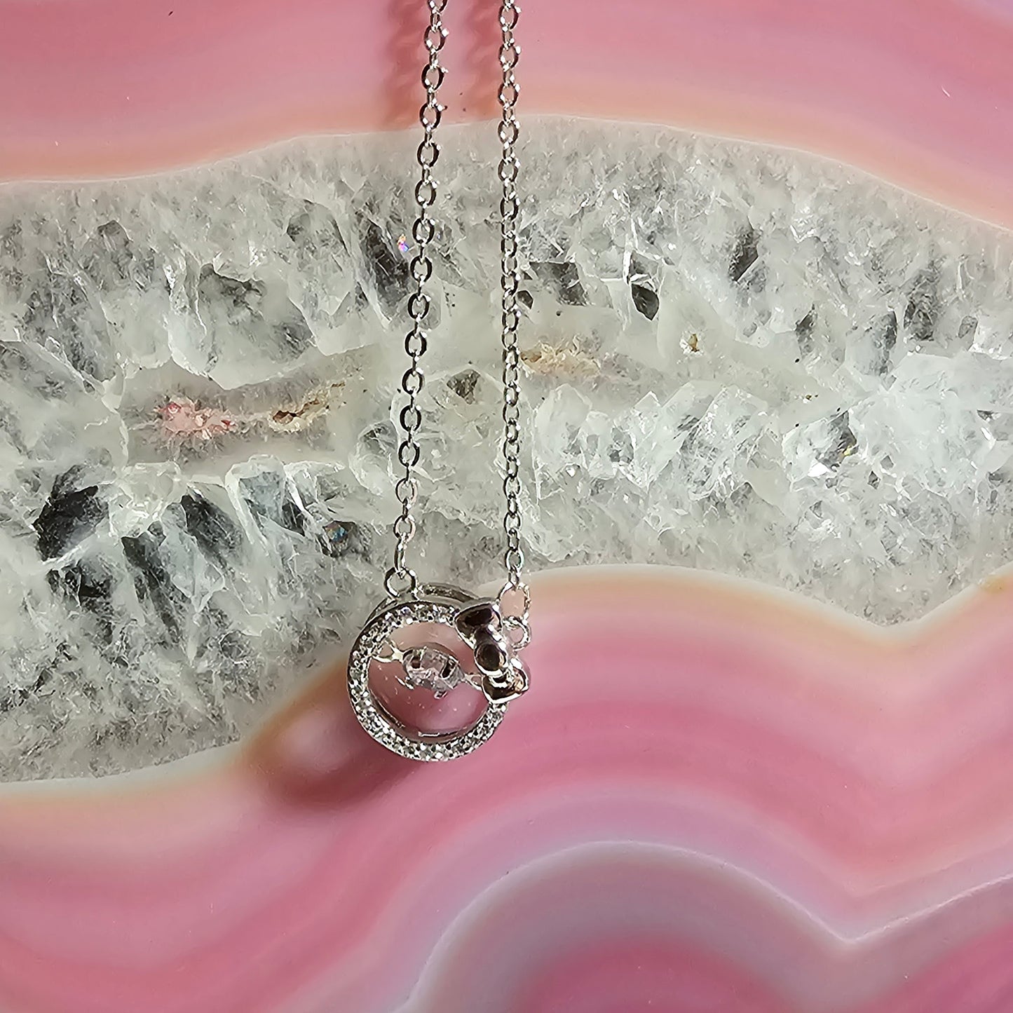 SILVER CIRCLE WITH BOW NECKLACE